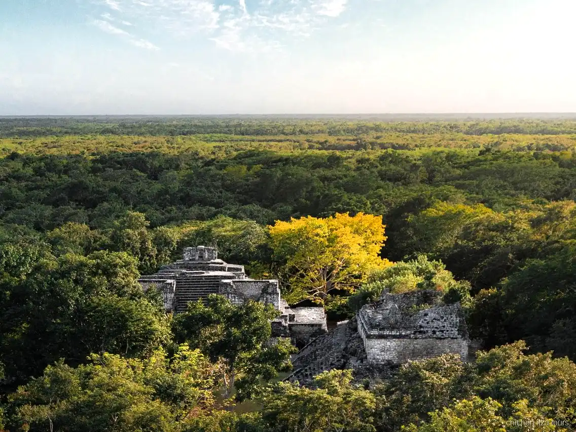 Guide explaining Maya cosmology at Chichen Itza on the Ek Balam combo tour